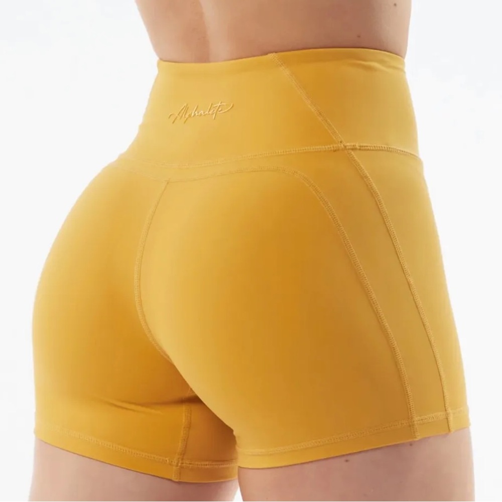 Alphalete yellow surge shorts